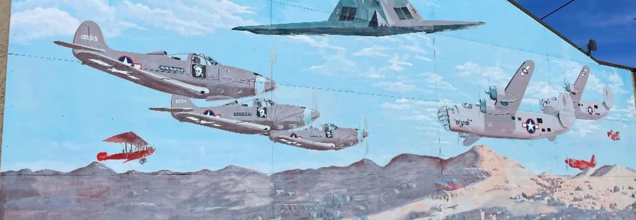 Tonopah Aviation Mural, Lee Bowerman, 2005: Depicting military and civilian aircraft that were based at or tested near Tonopah. 140 S. Main Street/side wall of Town Office