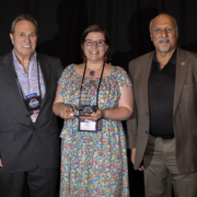 Marvin Minnick, Nevada Silver Trails Territory Chair, Kat Galli, Nevada Silver Trails Excellence in Tourism Award Winner, and Nevada Lt. Governor Stavros Anthony at the Excellence in Tourism Awards at Travel Nevada's Rural Roundup conference in Mesquite, Nevada.