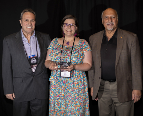 Marvin Minnick, Nevada Silver Trails Territory Chair, Kat Galli, Nevada Silver Trails Excellence in Tourism Award Winner, and Nevada Lt. Governor Stavros Anthony at the Excellence in Tourism Awards at Travel Nevada's Rural Roundup conference in Mesquite, Nevada.